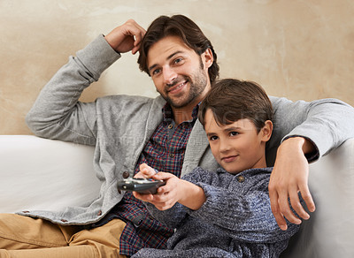 Buy stock photo Happy, TV and father and child on sofa with remote for bonding, relationship and relax in living room. Family, parents and dad with young son for cartoon, watching movies and entertainment in home