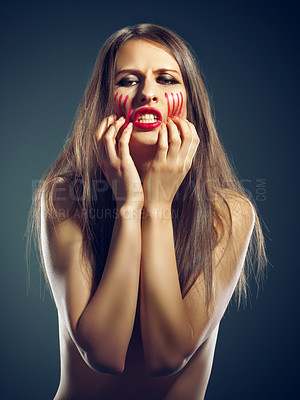 Buy stock photo Portrait, rage and woman with anger, blood and person on a dark studio background. Face, model and girl with expression or upset with emotion and furious with stress and emoji with conflict or crisis