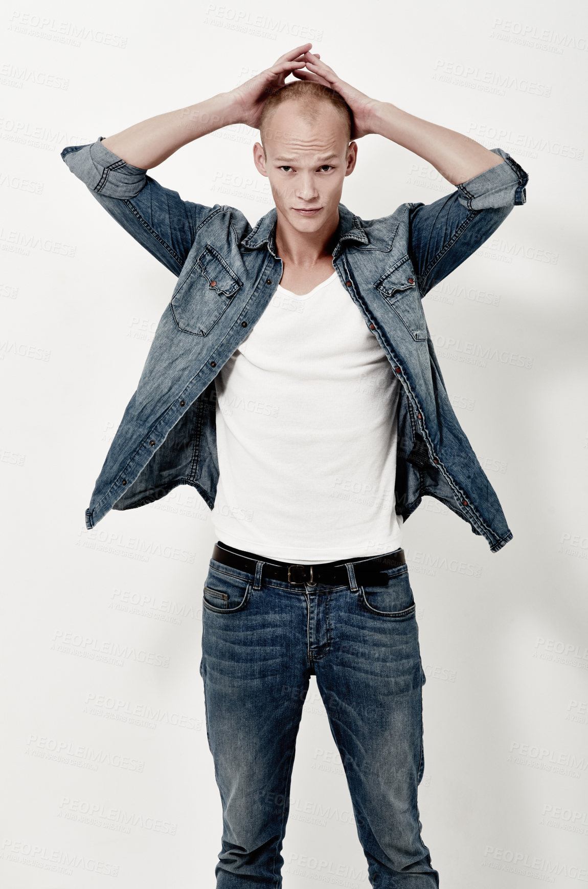 Buy stock photo Fashion, confidence and portrait of man in jeans at studio isolated on a white background. Cool, style and serious model in denim, jacket and young person in casual clothes on a backdrop in Australia