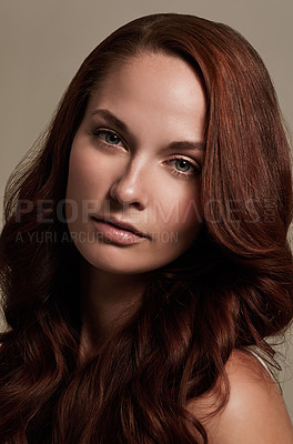 Buy stock photo Portrait, beauty and hair with a model woman in studio on gray background for makeup or skincare. Face, haircare and cosmetics with a young female red head at the salon or hairdresser for a makeover