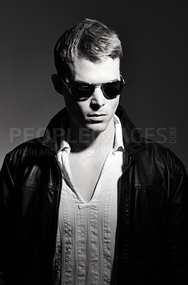 Buy stock photo Man, monochrome and confidence for fashion in studio, sunglasses and cool outfit on black background. Male person, attitude and serious face for style, edgy aesthetic and casual clothing for style