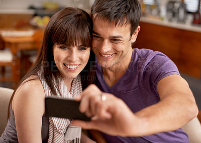 Buy stock photo Love, hug and happy couple with selfie in house for bonding, photography or memory with care. Smartphone, profile picture or people embrace with romance at home for social media, blog or vlog update