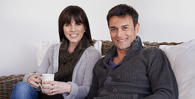 Buy stock photo Love, portrait and happy couple relax on a sofa with trust support and bonding with morning coffee at home. Smile, face or people in living room with security, safety and chilling together in a house