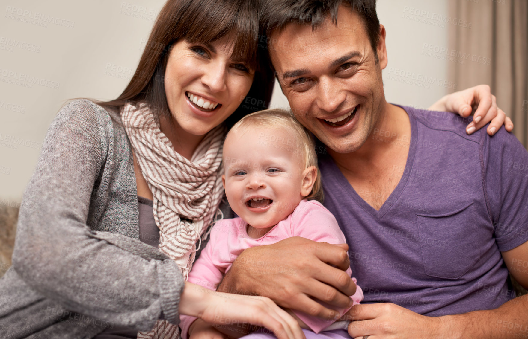Buy stock photo Love, portrait and parents hug baby in a house with comfort, safety or bonding together. Face, happy family and people with excited girl in a living room with child development, support and security