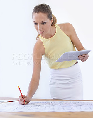 Buy stock photo Tablet, architect and woman with blueprint, drawing or sketch at desk in startup office. Technology, engineer and creative designer with pencil on paper for planning construction project for building