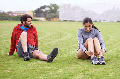 Buy stock photo Couple, exercise and grass with stretching legs, smile and workout together for fitness in summer. People, training and outdoor for muscle health with balance, wellness and happy on lawn in England