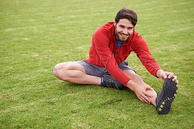 Buy stock photo Fitness, stretching and portrait of man on field for exercise, workout and training for running outdoors. Sports, park and person warm up for wellness, healthy body and flexible for performance