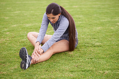Buy stock photo Woman, fitness and stretching legs on field with sitting, training and exercise for health in summer. Girl, person and workout for wellness with sport, outdoor or thinking on grass lawn in Australia