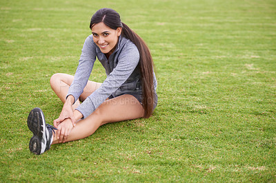 Buy stock photo Woman, sitting and stretching legs on grass with exercise, training and happy for portrait in summer. Girl, person and workout for body wellness with smile, fitness and muscle on lawn in Australia
