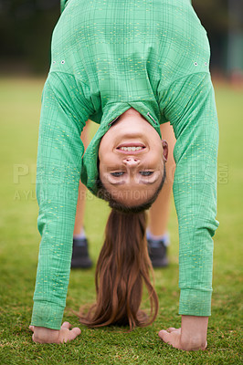 Buy stock photo Happy woman, portrait and stretching body on green grass for exercise, workout or outdoor training in nature. Face of female person in warm up or fitness for flexible, health and wellness on field