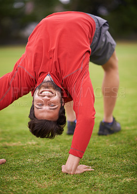 Buy stock photo Man, exercise and grass with stretching back, arching and workout for fitness in summer. Person, training and outdoor in portrait for muscle health with balance, wellness or nature on lawn in England