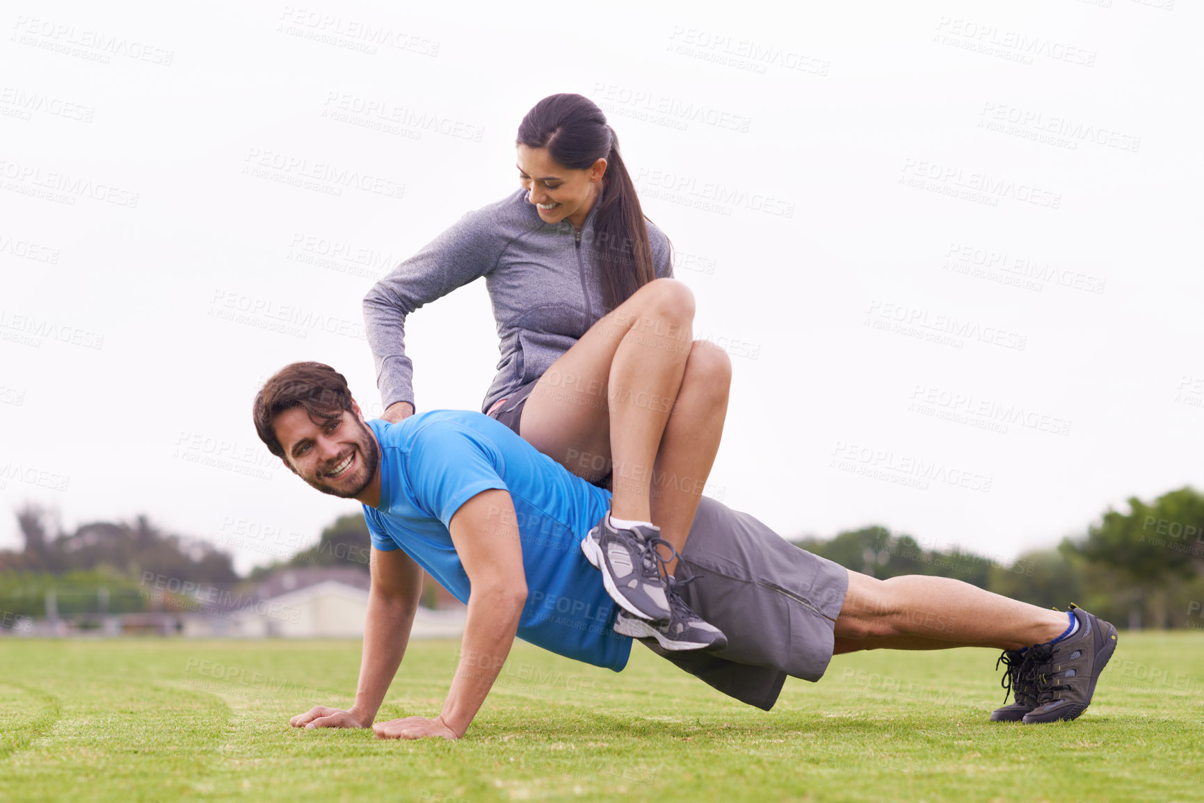 Buy stock photo Young people exercising outdoors