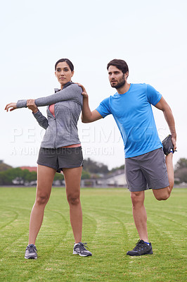 Buy stock photo Couple, fitness and stretching body on green grass for workout, exercise or outdoor preparation. Active, young man and woman in warm up or getting ready for training or running together on open field