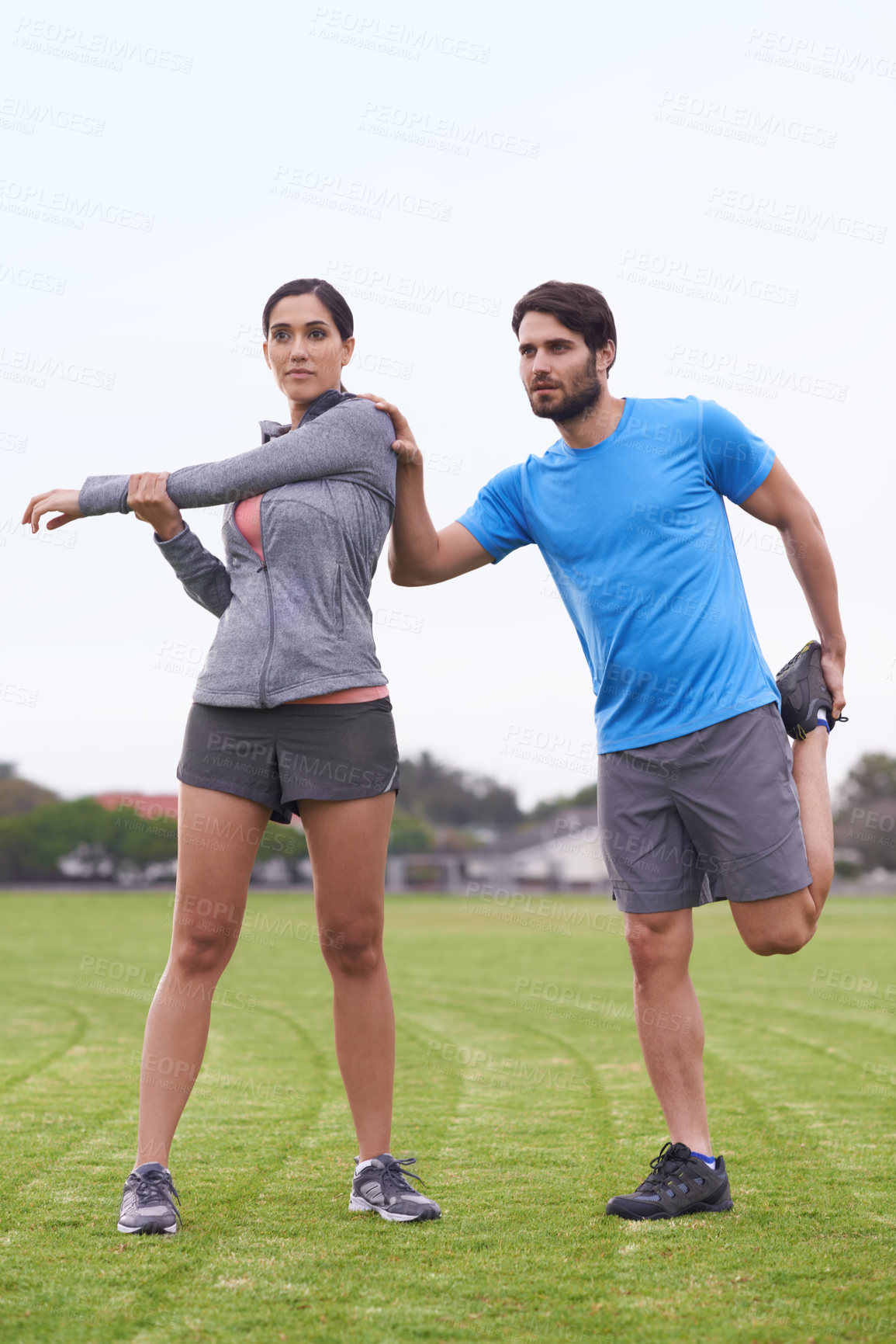 Buy stock photo Couple, fitness and stretching body on green grass for workout, exercise or outdoor preparation. Active, young man and woman in warm up or getting ready for training or running together on open field