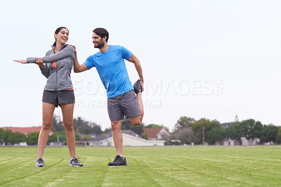 Buy stock photo Happy couple, fitness and stretching body on green grass for outdoor workout or exercise in nature. Active, young man and woman in warm up together for training, health and wellness on mockup space