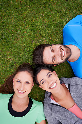 Buy stock photo Smile, fitness and portrait of friends on grass for workout, exercise and healthy lifestyle from high angle. Sports, face and happy people outdoors for bonding, connection or break for training