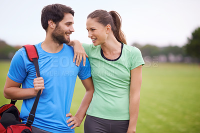 Buy stock photo Fitness, couple and outdoor for workout on field, happy and healthy with partner, physical activity and support. People smile for wellness, exercise together in park and training for bonding