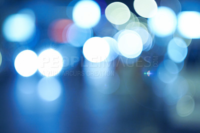 Buy stock photo Bright lights, abstract and night with pattern, city and graphic against a blue background. Creativity, bokeh and blur with aesthetic and shining with colours and effect with circles and glowing