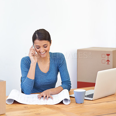 Buy stock photo Happy, woman and phone call with blueprint and laptop of small business and renovation plan with smile. Employee, conversation and paperwork of office development with mobile and moving at morning 