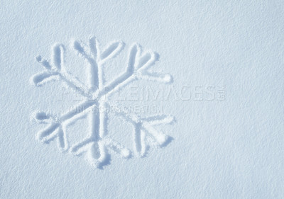 Buy stock photo Above shot of a snowflake shape or pattern drawn in the snow during an icy cold winter with copyspace. The first sign of winter. The weather is changing. The cold season has arrived. First snowfall