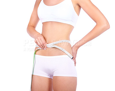 Buy stock photo Woman, waist and measuring tape in studio with hands, weight loss or fitness for wellness by white background. Isolated model, girl and underwear with diet goal, body or stomach for healthy abdomen