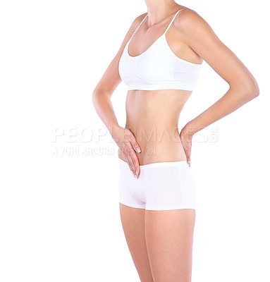 Buy stock photo Woman, flat stomach and hands in studio with waist, measuring or fitness for wellness by white background. Isolated model, girl and underwear with touching, body or abdomen for healthy lifestyle