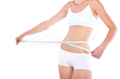 Buy stock photo Hands, measuring tape and woman in studio for weight loss, fitness for wellness, health and white background. Isolated model, girl and underwear with diet, waist and stomach with healthy lifestyle