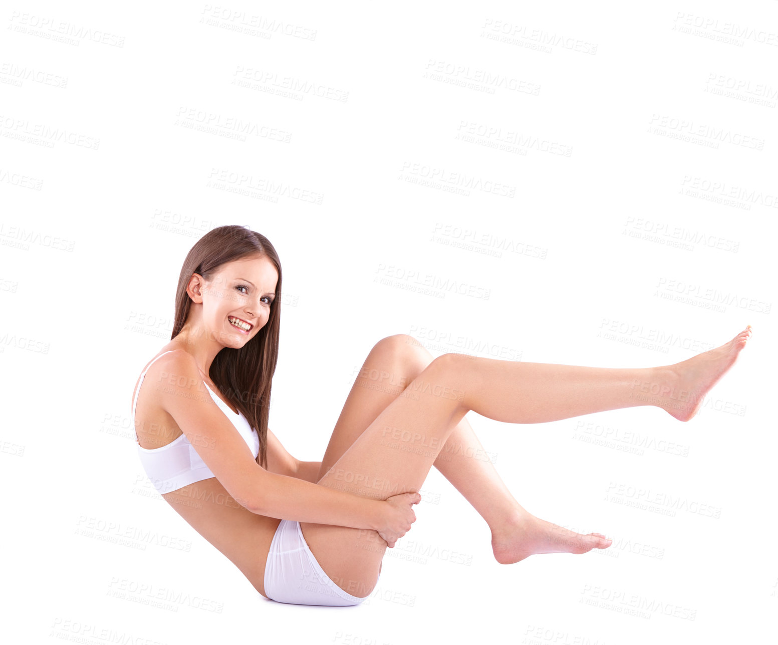 Buy stock photo Full body studio shot of a young woman caressing her bare leg