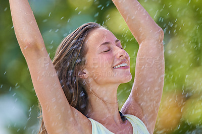 Buy stock photo Stretching, rain and happy with woman, freedom and cheerful with celebration and excited. Outdoor, person or girl in a park, wet or carefree with winner or expression with a break, victory and joyful