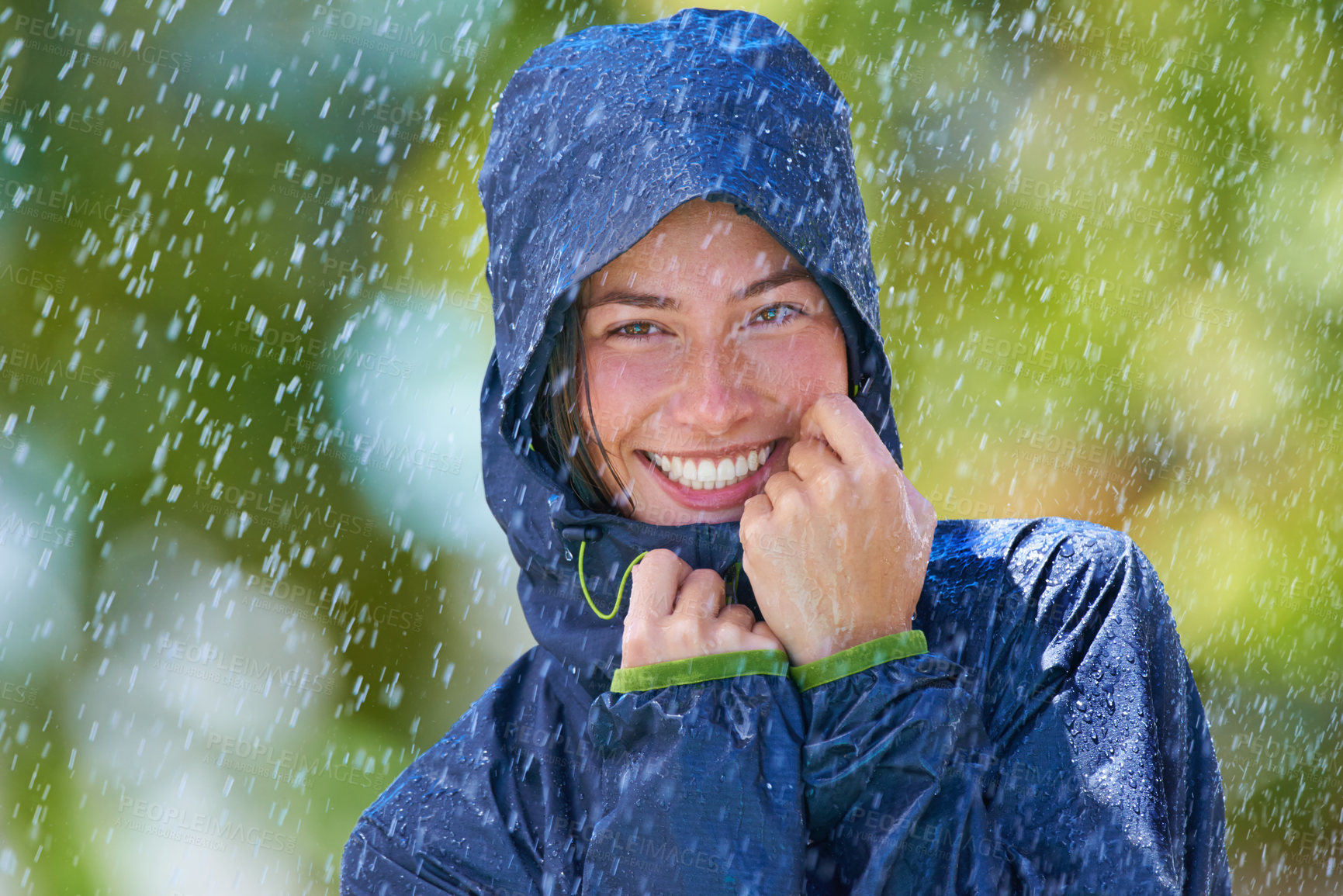 Buy stock photo Woman, rain and portrait with a smile from winter climate, water and weather outdoor in a park. Happy, travel and female person with jacket for cold on holiday and vacation with raincoat and joy