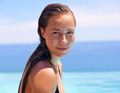 Buy stock photo Portrait, summer and swimming pool with woman tourist outdoor for holiday or vacation to relax on blue sky. Face, travel and wet with confident young swimmer person in water for resort getaway