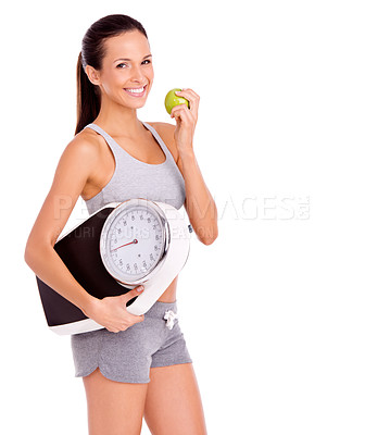 Buy stock photo Scale, apple and portrait of woman in studio with snack for weight loss, health and wellness diet. Fitness, vitamins and female person eating organic, fresh and nutrition fruit by white background.