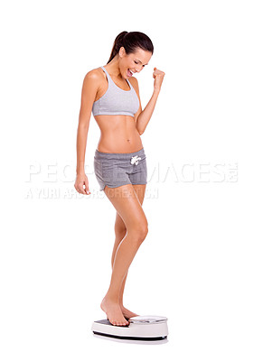 Buy stock photo Fitness, celebration and woman on scale in studio for weight loss, health or wellness victory. Happy, sport and slim person on measuring body for exercise, workout or training by white background.