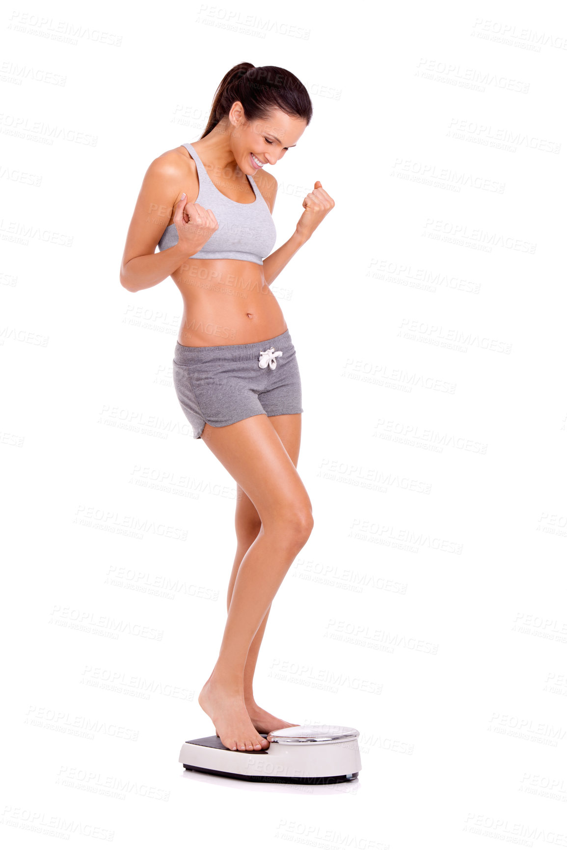Buy stock photo Sports, celebration and woman on scale in studio for weight loss, health or wellness victory. Happy, fitness and slim person on measuring body for exercise, workout or training by white background.