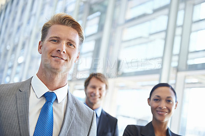 Buy stock photo Businessman, portrait and confidence in career, office and pride in profession. Business people, teamwork and collaboration or support in workplace, smiling and entrepreneur of startup company