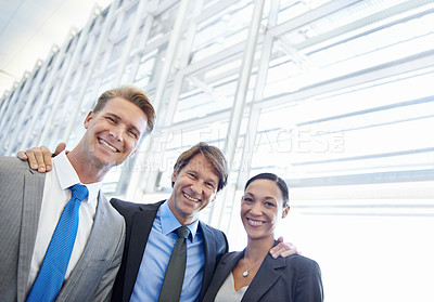 Buy stock photo Business people, portrait and confident in cooperation, embrace and pride in partnership. Happy coworkers, teamwork and collaboration or support in workplace, smiling and hugging for solidarity