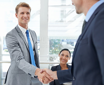 Buy stock photo Handshake, collaboration and business people in office for deal, agreement or partnership. Smile, meeting and professional men shaking hands for company onboarding or hiring welcome in workplace.