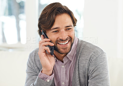 Buy stock photo A handsome young man talking on his cellphone