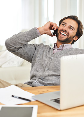 Buy stock photo A handsome businessman speaking on his mobile at his desk