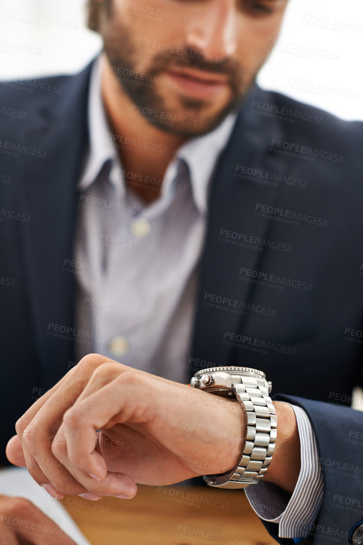 Buy stock photo Cropped shot of a businessman checking the time on his watch