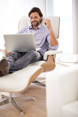 Buy stock photo Businessman, relax and couch with computer online for remote work, living room and home office for freelance job. Male person, social media and browsing or research on laptop, sofa and smile