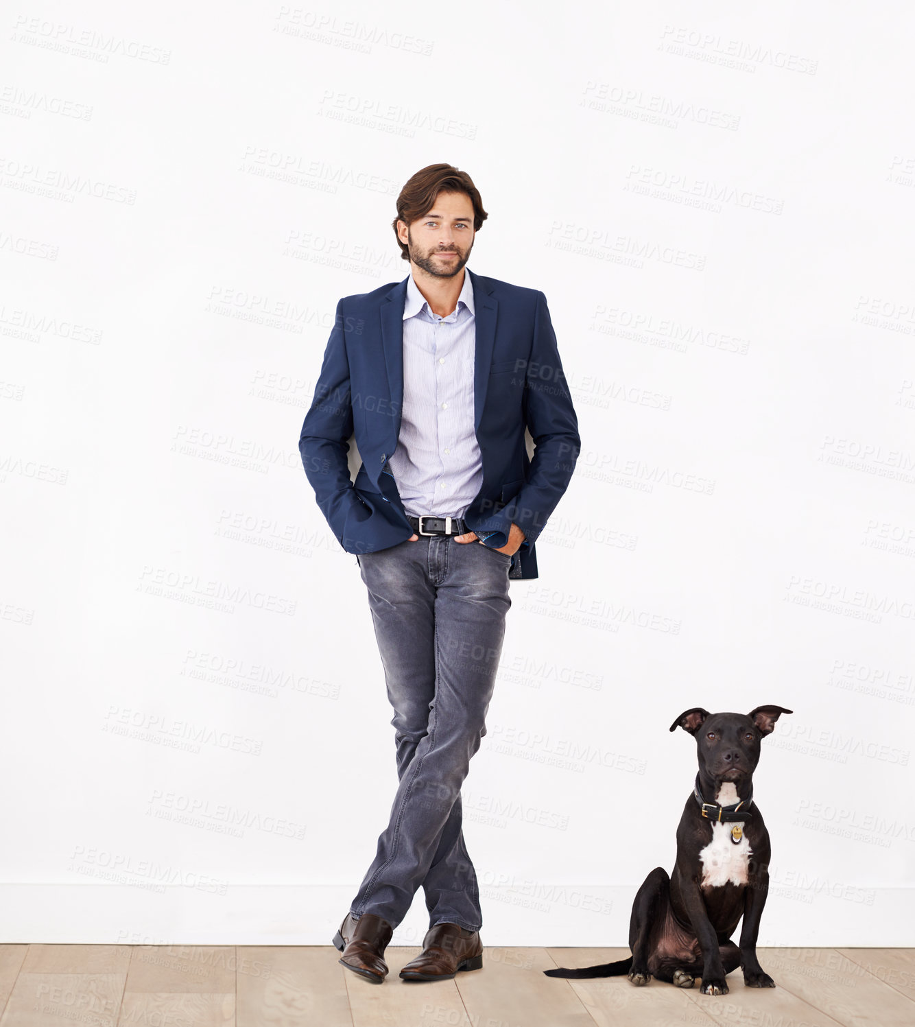 Buy stock photo A handsome man standing next to his dog - portrait
