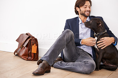 Buy stock photo Smile, love and happy businessman with dog for bonding together with positive and good attitude. Career, briefcase and professional male person playing with pet, puppy or animal on floor at home.