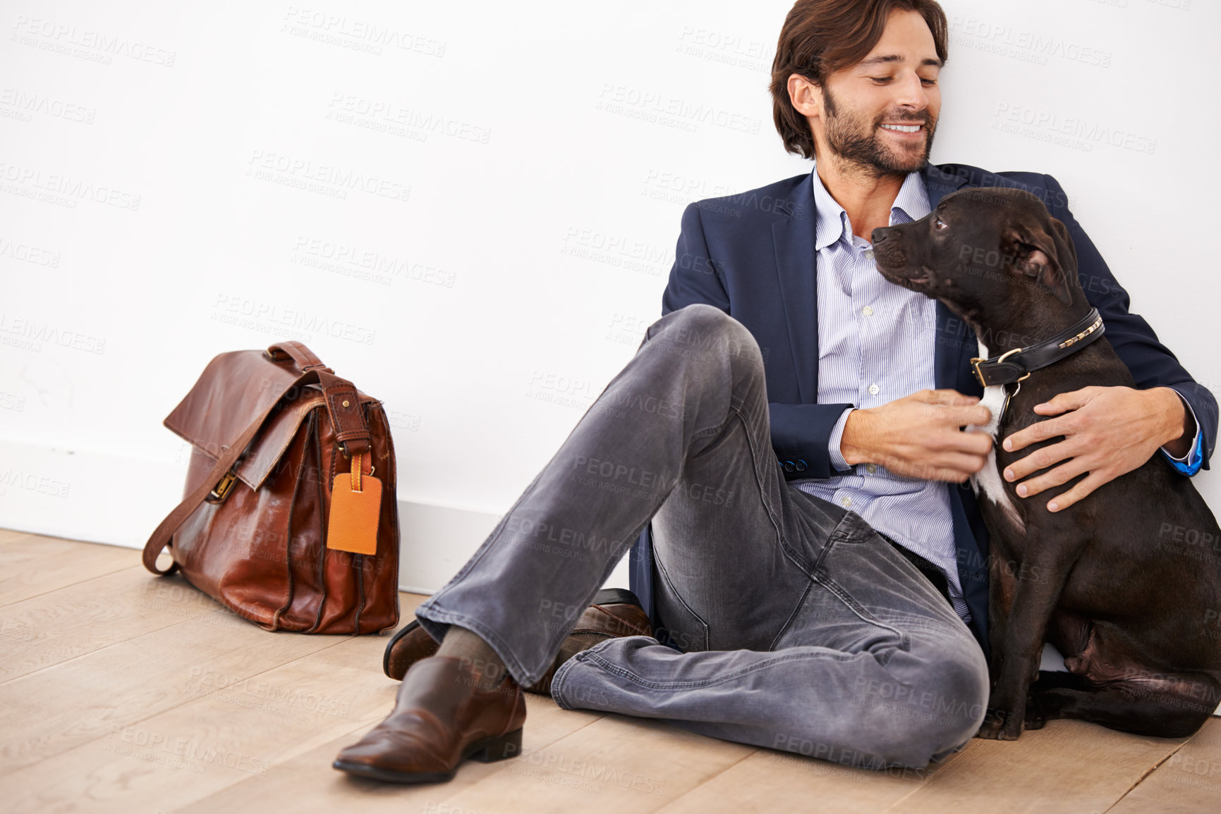 Buy stock photo Smile, love and happy businessman with dog for bonding together with positive and good attitude. Career, briefcase and professional male person playing with pet, puppy or animal on floor at home.