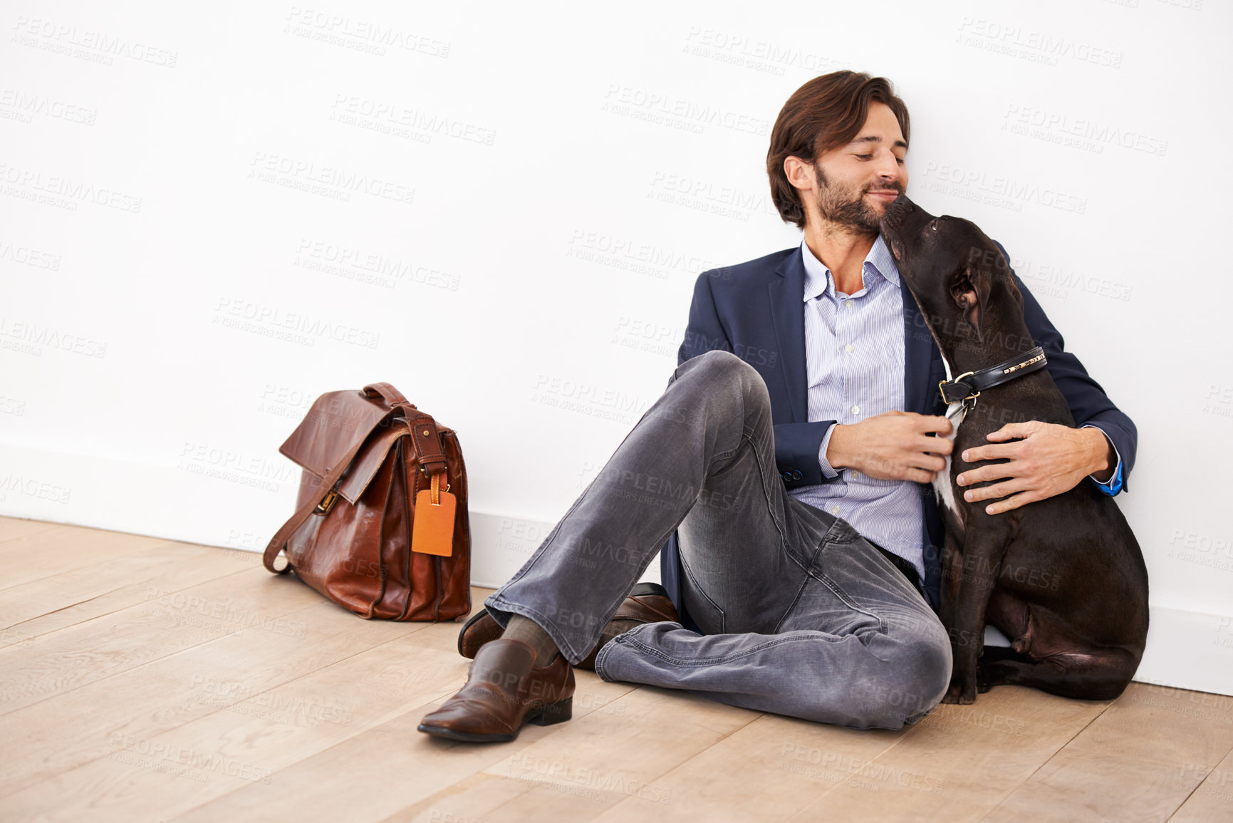 Buy stock photo Care, love and happy businessman with dog for bonding together with positive and good attitude. Career, briefcase and professional male person playing with pet, puppy or animal on floor at home.
