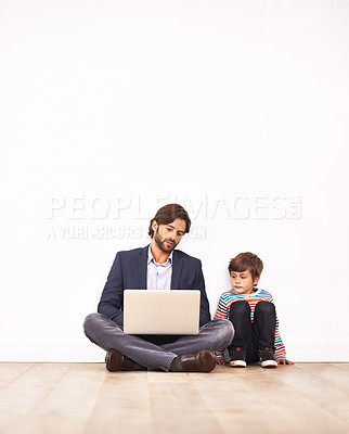 Buy stock photo Businessman, son and relax on floor with laptop for remote work with video streaming, online games or movies in home. Family, father or kid with technology on ground for bonding, communication or fun