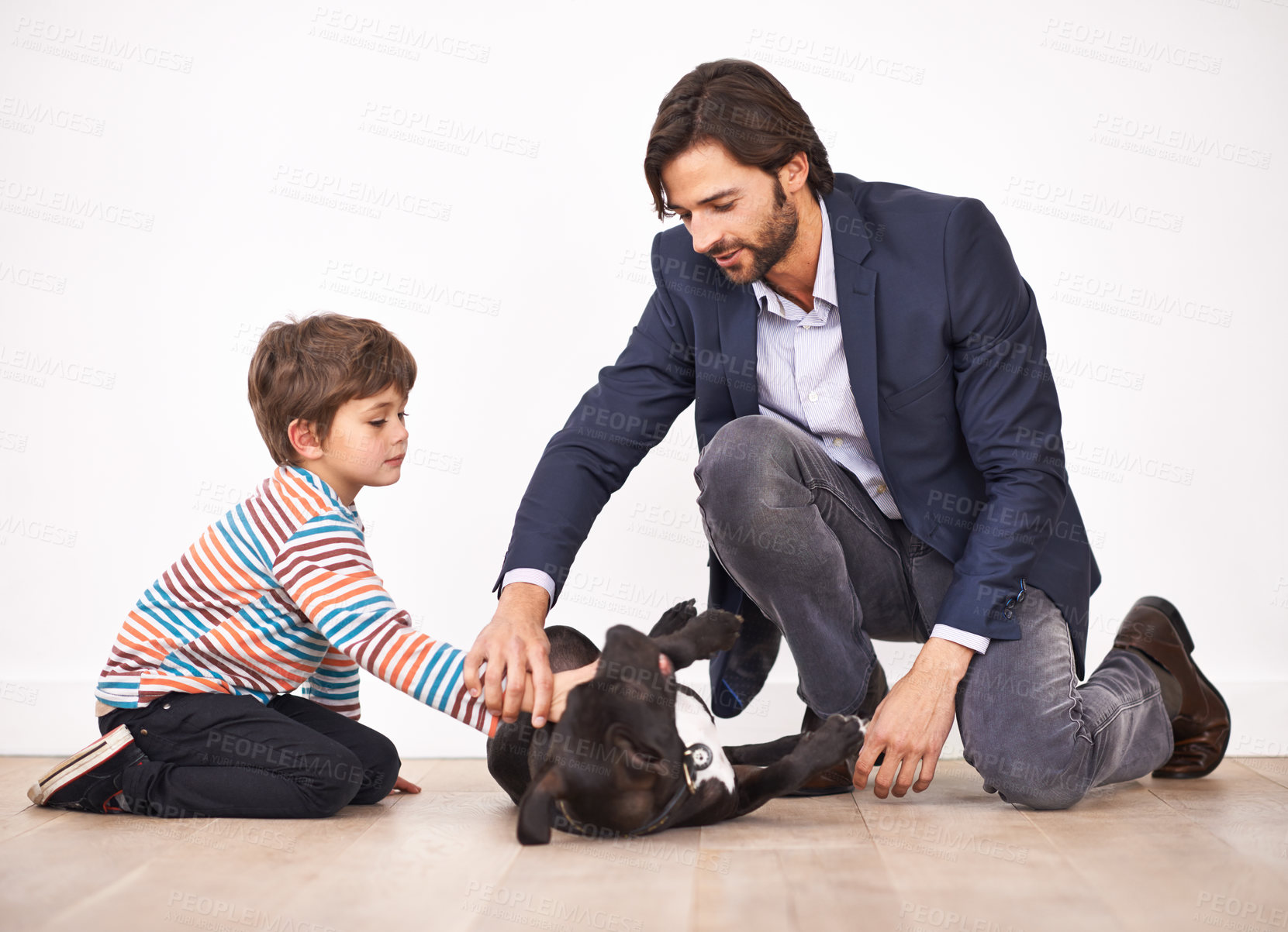 Buy stock photo Father, child and pet dog on the floor, having fun and boy bonding with parent for leisure. Canine, kid and dad playing with animal for care, learning and love of family together at home to relax