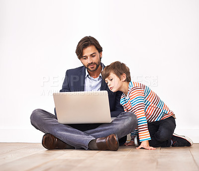 Buy stock photo Father, child and laptop on floor for learning, online education and teaching boy at home. Kid, dad and computer for internet, studying and family reading information on technology for communication