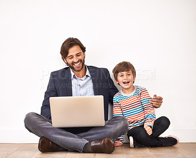 Buy stock photo Father, laptop and portrait of child for funny movie, game or parent reading meme with boy at home. Kid, dad and smile with computer for comedy, laughing and family bonding together with technology