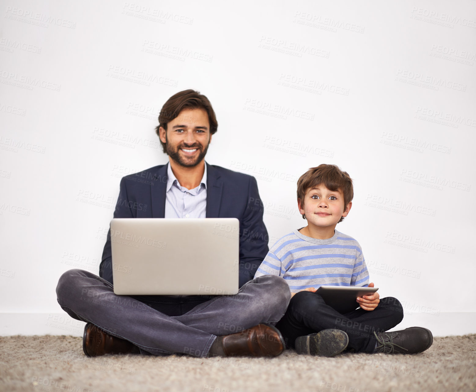 Buy stock photo Father, happy kid and portrait with laptop, tablet and learning with boy at home by wall. Smile, child and dad on computer with tech for remote work, love or connection of family together on floor